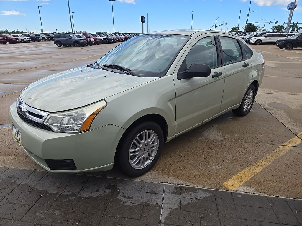 2011 Ford Focus SE in Natural Neutral Metallic — front three-quarter view