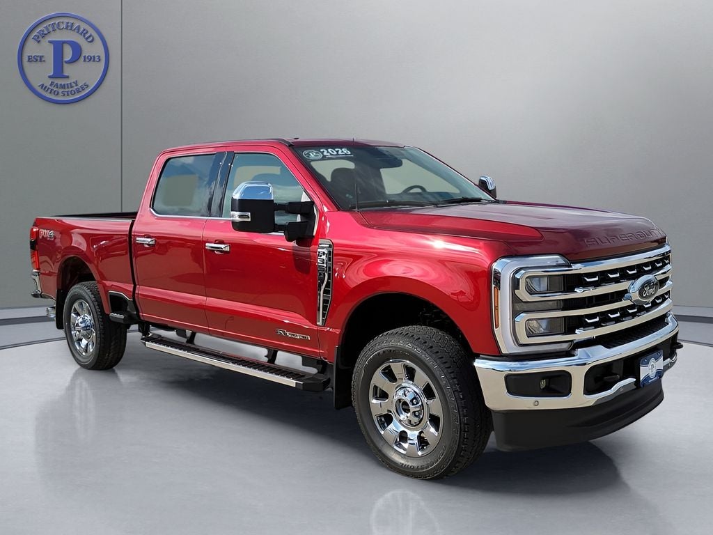 2026 Ford Super Duty F-350 Lariat in Ruby Red Metallic Tinted Clearcoat — front three-quarter view