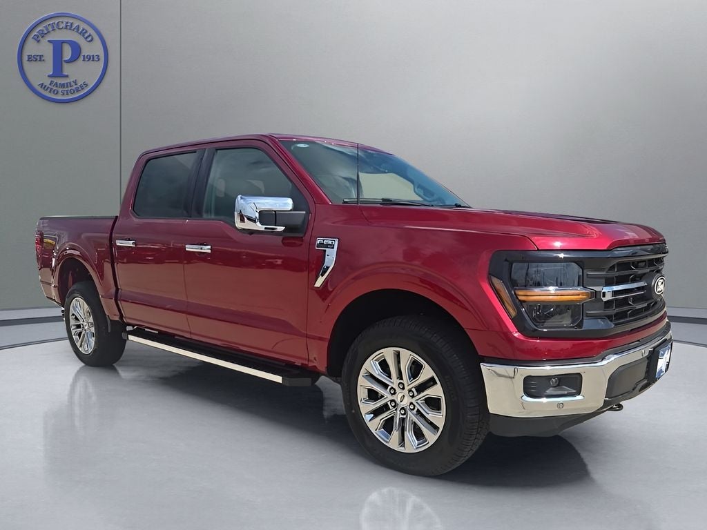 2026 Ford F-150 XLT in Ruby Red Metallic Tinted Clearcoat — front three-quarter view