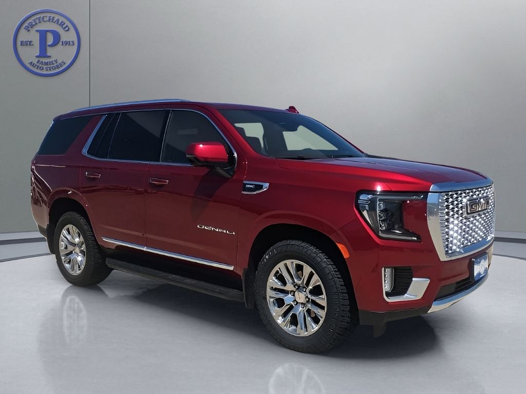 2022 GMC Yukon Denali in Cayenne Red Tintcoat — front three-quarter view