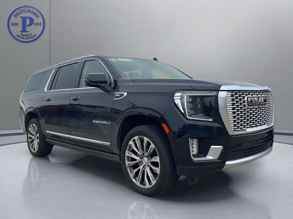 2024 GMC Yukon XL Denali in Midnight Blue Metallic — front three-quarter view