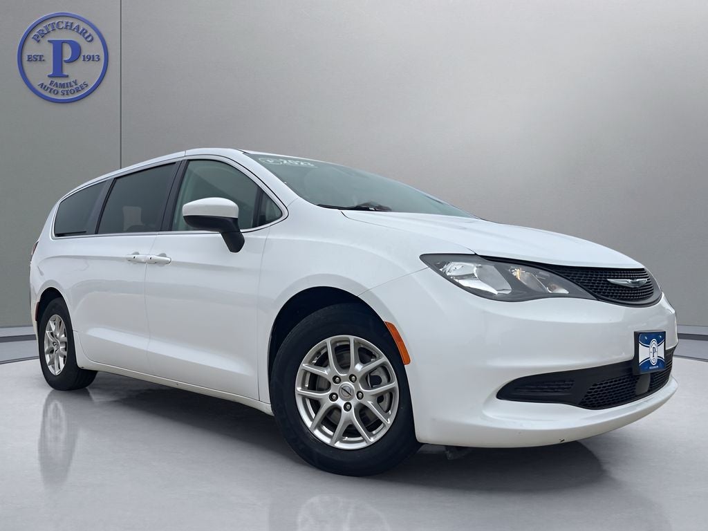 2023 Chrysler Voyager LX in Bright White Clearcoat — front three-quarter view