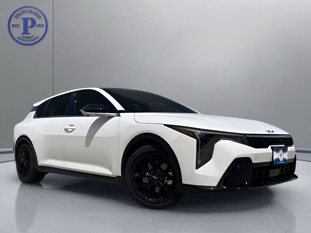 2026 Kia K4 GT-Line Turbo in Snow White Pearl — front three-quarter view